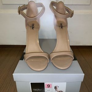 Tan strap heel, sized 9. Brand new, worn 1 time.